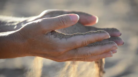 Sand pours out of the hands Stock Footage 27747712