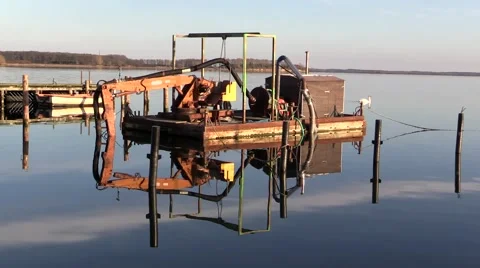 Sand pump equipped barge anchored at sunset in beautiful seascape Video stock 48872364