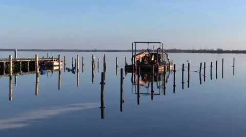 Sand pump equipped barge anchored at sunset in calm sea in beautiful seascape Stock-Footage 49021785