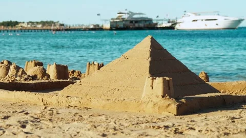 A sand pyramid built on a beach in Egypt by vacationing children. Video stock 330062010