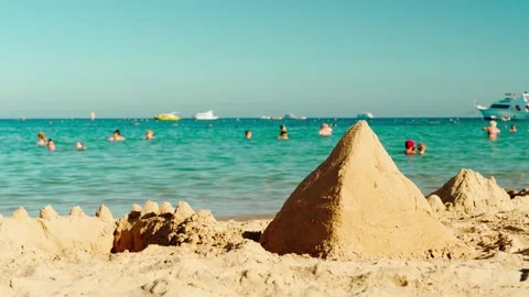 A sand pyramid built on a beach in Egypt by vacationing children. 스톡 동영상 330062039