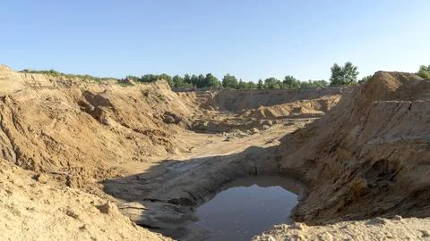 Sand quarry in the sun's rays 스톡 사진