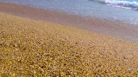 Sand rocks pebbles mussels shells waves footprint footprints Phuket Thailand. Stock Footage 322720462