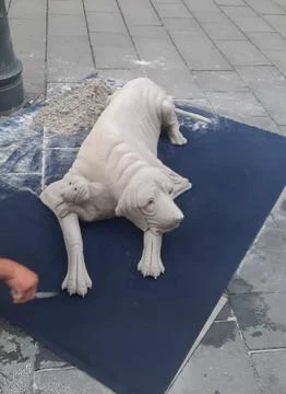 Sand sculpture of a dog Stock Photos