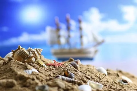 Sand shell and sail in sea sand shell and sail in sea ,model released, Sym... Stock-Fotos