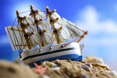 Sand shell and sail in sea Stock-Fotos