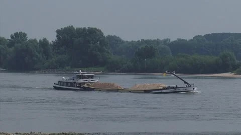 Sand ship navigating downstream river Waal, The Netherlands Stock Footage 40416882
