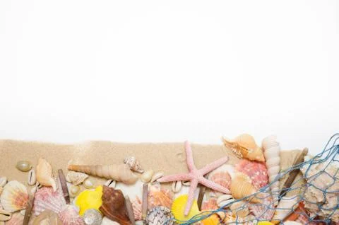 Sand starfish seashell on white background with a fishing net Foto stock