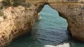 Sand stone cliff hole at Algarve coastline Portugal 4k or 4k+ Resolution