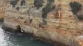 Sand stone cliffs zoom out at Algarve coastline Portugal 4k or 4k+ Resolution