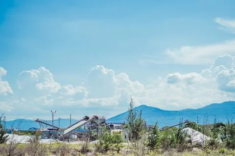 Sand stone crush process refinery operating conveyor belt mining terminal Stock Photos