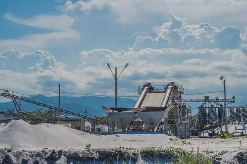 Sand stone crush process refinery operating conveyor belt mining terminal Stock Photos