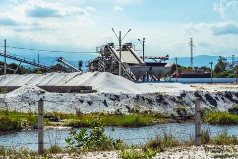 Sand stone crush process refinery operating conveyor belt mining terminal Stock Photos