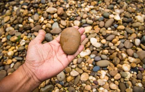 Sand stone on hand Stock Photos