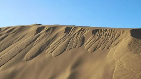 Sand storms in desert in windy day in XiangshaWan, or Singing sand Bay, in ho Stock Footage 136466097