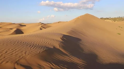 Sand storms in desert in windy day in XiangshaWan, or Singing sand Bay, in ho Stock Footage 136466115