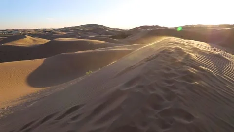 Sand storms in desert in windy day in XiangshaWan, or Singing sand Bay, in ho Stock Footage 136466141