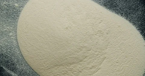 Sand-like substance bouncing off of vibrating surface forming cymatic Video stock 137633064