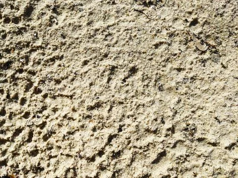 Sand surface texture with small animal tracks in natural daylight outdoor Stock Photos