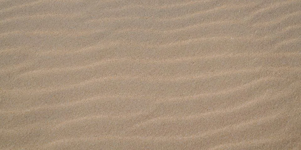 Sand texture background panoramic with sandy wave pattern for web header pano Stock Photos