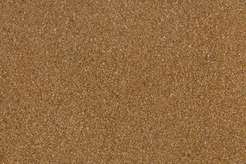 Sand texture background. Sandy beach pattern near sea. Desert ground. Fine gr Stock Photos