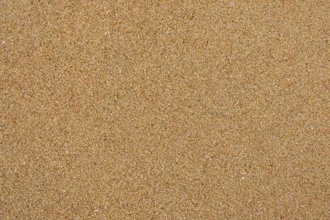 Sand texture background. Sandy beach pattern near sea. Desert ground. Fine gr Stock Photos