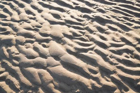 Sand texture background with sandy water wave pattern wallpaper Stock Photos