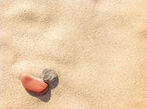 Sand texture background, with two stones shapes Stock Photos