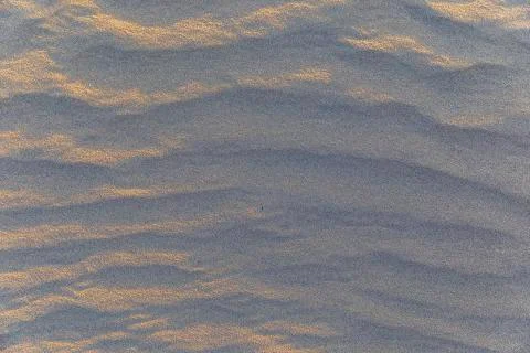 Sand texture on the beach after the wind Stock Photos