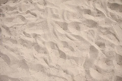 Sand texture at the beach close-up background with copy space Stock Photos