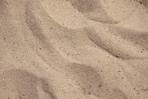 Sand texture at the beach close-up background with copy space Stock Photos