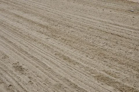 Sand texture with diagonal traces Stock Photos