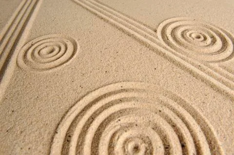 Sand texture, patterns drawn in sand Stock Photos