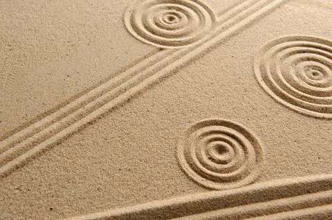 Sand texture, patterns drawn in sand Stock Photos