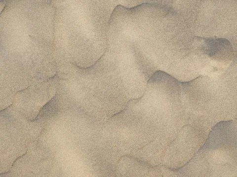 Sand texture. Sandy beach for background. Top view Stock Photos