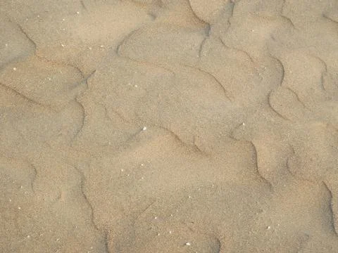 Sand texture. Sandy beach for background. Top view Stock Photos
