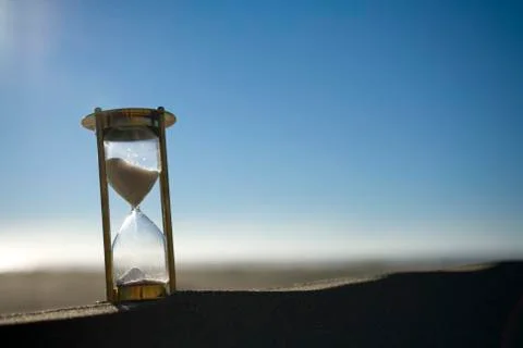 Sand timer on a sand dune Stock Photos