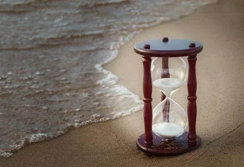 Sand timer on the seashore Stock Photos