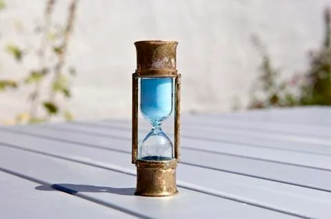 Sand timer on table - hourglass on table Stock Photos