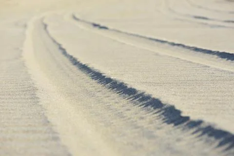 Sand trace of  wheels Stock Photos