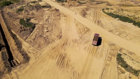 Sand transport from open pit. Dump truck transports sand in open-pit Stock Footage 156627332
