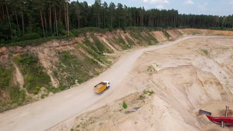 Sand transport from open pit. Dump truck transports sand in open-pit Video stock 161960894