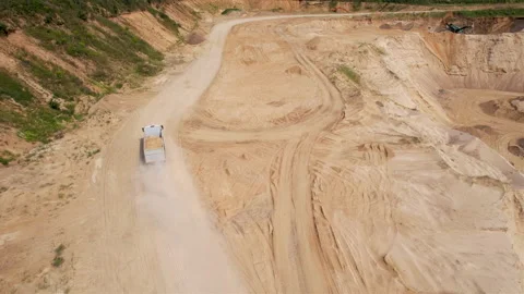 Sand transport from open pit. Dump truck transports sand in open-pit Видео 161960895
