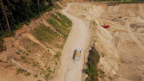 Sand transport from open pit. Dump truck transports sand in open-pit Video stock 161971549