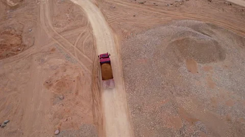 Sand transport from open pit. Dump truck transports sand, drone view. Video stock 193993455