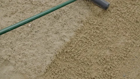 Sand trap rake overhead Stock Footage