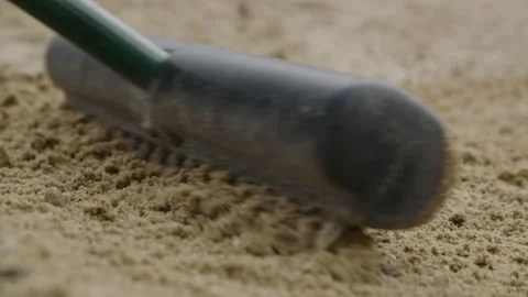 Sand trap rake pushing through sand 스톡 동영상 153697985