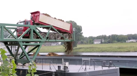 Sand truck unloading cargo on a ship Stock Footage 60698331