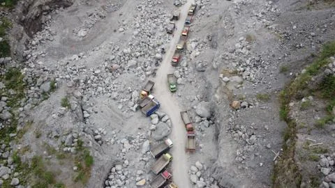 Sand trucks on the slopes of Mount Merapi Stock Photos