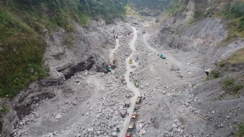 Sand trucks on the slopes of Mount Merapi Stock Photos